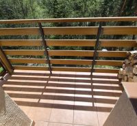 Balcony in a Recreational Apartment with Wooden Paneling and Firewood, Stará Lesná.