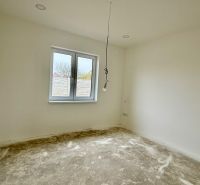 Interior in a family house with white walls and an empty floor with a wooden decor.