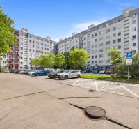 Parking lot in front of the apartment building on Kríkova Street in Bratislava, Vrakuňa.