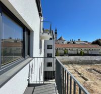 The balcony of a 2-room apartment on Jarková Street in Prešov with a view of the city skyline.