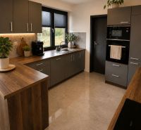A kitchen in a family house with a floor and kitchen countertop with a wooden decor.