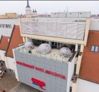 Department store Jednota on Trojičné Square in Trnava with dining spaces on the terrace.