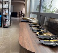 Gastro premises with prepared plates and cutlery on the floor with wooden decor.