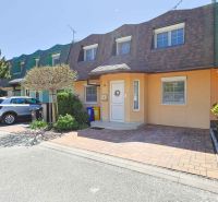 A family house on Hollého Street in Stupava with a garage, a car, and a well-maintained garden.
