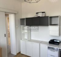 Interior of a family house with white and gray furniture, floor with wooden decor.