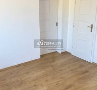Interior of a family house with white doors and a floor with a wood decor.