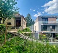 Family houses on Búdková Street in Bratislava - Staré Mesto surrounded by greenery and stairs.