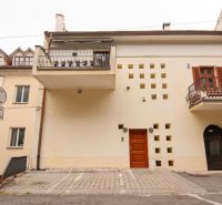 Beblavého, Bratislava - Staré Mesto: The facade of the building with balconies and a parking lot in front of the entrance.