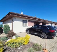 A family house on Poľná Street in Dudince with a driveway and a landscaped garden.