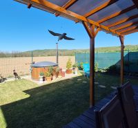 A garden at a family house on Poľná cesta in Dudince with a gazebo and a garden hot tub.