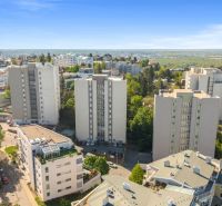 A view of residential buildings surrounded by greenery in Bratislava - Old Town.