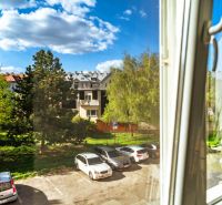 View from the window of the parking lot and greenery on Krivá Street, Košice - Juh district.
