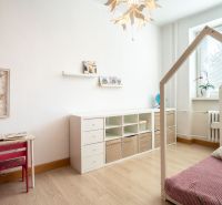 Children's room with a bed, shelves, and a desk, 3-room apartment.