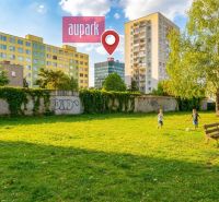 Playground with children and surrounding residential buildings in Košice, Krivá.