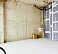 Concrete walls and electrical wiring in commercial spaces.