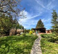 A garden at a family house in Veľké Chlievany with a walkway and a gazebo.