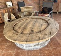 Rustic furniture in a family house with a wooden decor floor and stone.