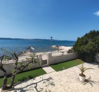 A family house in Bibinje offers a sea view with a stone terrace and garden greenery.