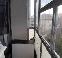Glazed balcony in a 2-room apartment with a view in Nové Zámky, dresser, chain.