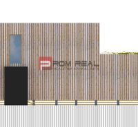 A wooden house on a plot in Borinka with a minimalist design, suitable for living.