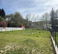 Plots - housing in Borinka with grassy vegetation and surroundings full of trees.