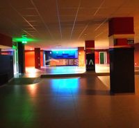 A commercial space with colorful lighting, ideal for business use and rental.