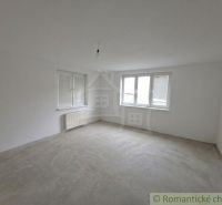 An empty room with windows and a radiator in a family house, floor with decor.