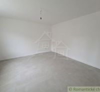 Empty room with white walls and exposed concrete surface in a family house.