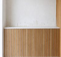 Commercial spaces with white walls and wooden decor, tiled floor.