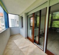 Glazed balcony with a view and entrance to a 3-room apartment.