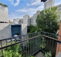 View from the balcony on Kováčska Street in Bratislava - Nové Mesto, surrounded by greenery.