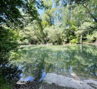 A river surrounded by greenery near Gabčíkovo, an ideal place for relaxation close to the cottage.