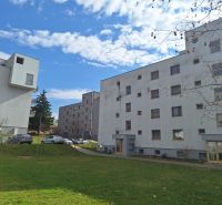 Two-room apartment buildings on Majakovského Street in Prešov with greenery in the courtyard.