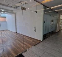 Glass doors, room with wood-patterned flooring, commercial premises.