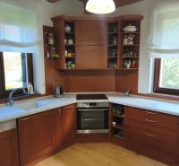 A kitchen with wooden decor and a countertop in a family house.