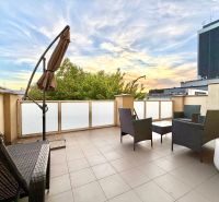 A spacious terrace in a 3-room apartment on Jána Hollého in Michalovce with outdoor furniture.