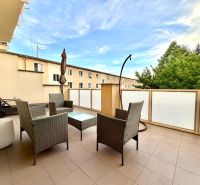The atmosphere of a 3-room apartment on Jána Hollého in Michalovce with outdoor seating.