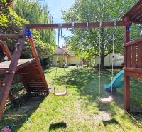 The garden of a family house on Devátova Street in Sládkovičovo with a children's playground.