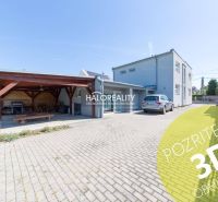 A family house in Vrakuňa with a carport and a landscaped garden.
