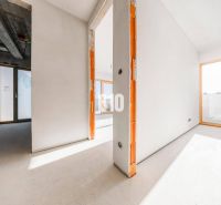 Interior of a 3-room apartment with large windows and a concrete ceiling.