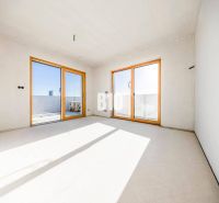 A spacious room with large windows in a 3-room apartment.