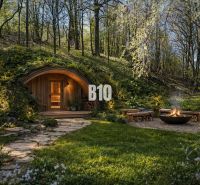 Earth house with a sauna and outdoor seating by the fire pit on a property in Banská Štiavnica.