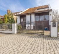 A family house on Dunajská Street in Hamuliakovo with a metal gate and a garden.
