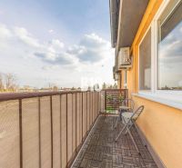 The balcony of a 2-room apartment with a view of M. R. Štefánik Street in Most pri Bratislave.