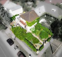 A family house in Bratislava - Staré Mesto surrounded by dense greenery and trees.