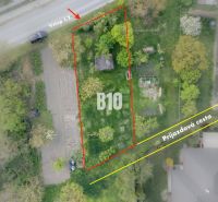 Aerial view of a residential plot in Dunajská Lužná with an access road.