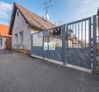 Family house with a gate on Jadranská Street in the Bratislava IV district, residential land.