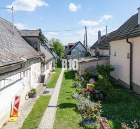 A narrow passageway with a garden and older houses on Jadranská Street in Bratislava IV. Plots - residential.