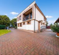 A family house in Štvrtok na Ostrove with a spacious yard and garden, brick design.