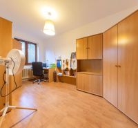 A room in a family house with wooden furniture and a wooden decor floor.